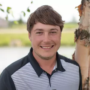 Colby Yates stands for a photo outside at Falcon Lakes Golf Course.