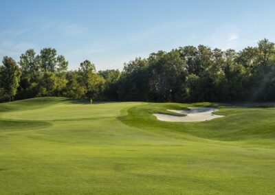 Photo of fairway, bunker, and green at Falcon Lakes Golf Course.