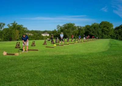 Golfers use the driving range at Falcon Lakes Golf Club.